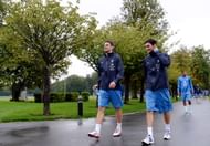 French national football team's  forward Olivier Giroud (C) and captain and goalkeeper Hugo Lloris (foreground R) arrive for a training session in Clairefontaine-en-Yvelines, outside Paris, on October 8, 2012, four days ahead of the friendly football match France vs Japan.